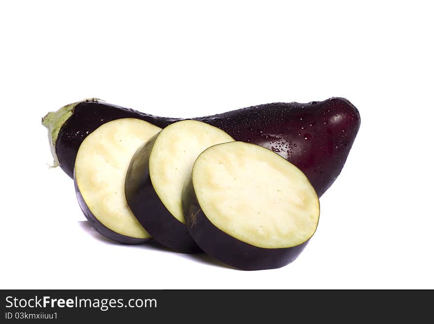 Close up view of an eggplant vegetable isolated on a white background. Close up view of an eggplant vegetable isolated on a white background.