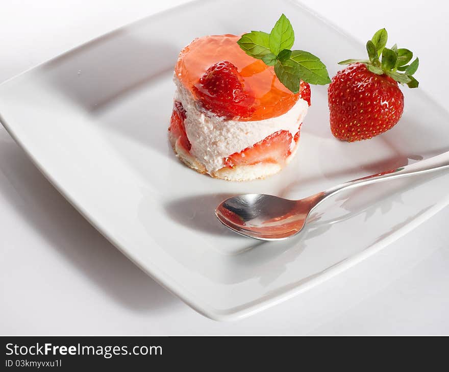 Strawberry cake on white plate