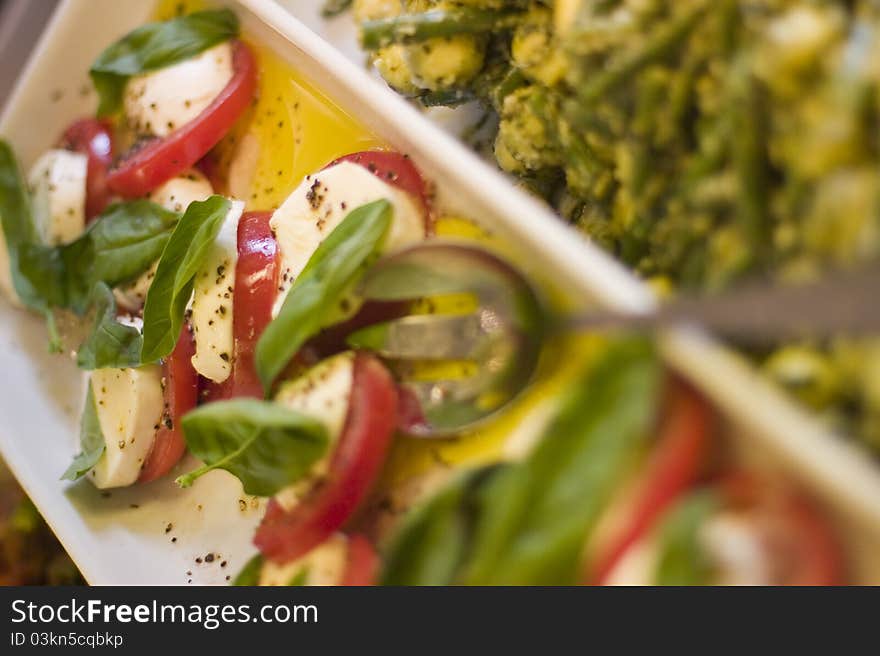 Tomatoes with mozarella and basil. Tomatoes with mozarella and basil