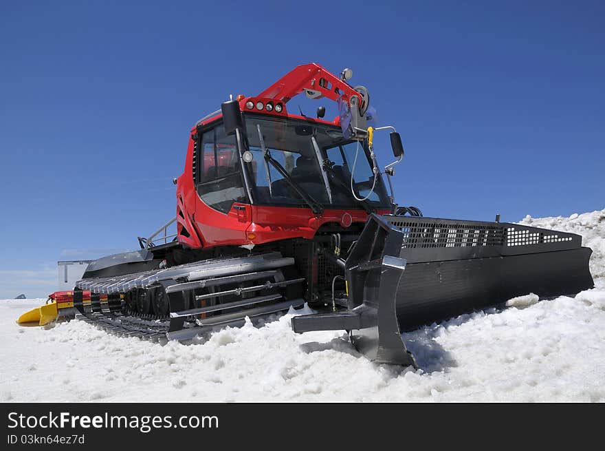 A red snowcat on the glacier