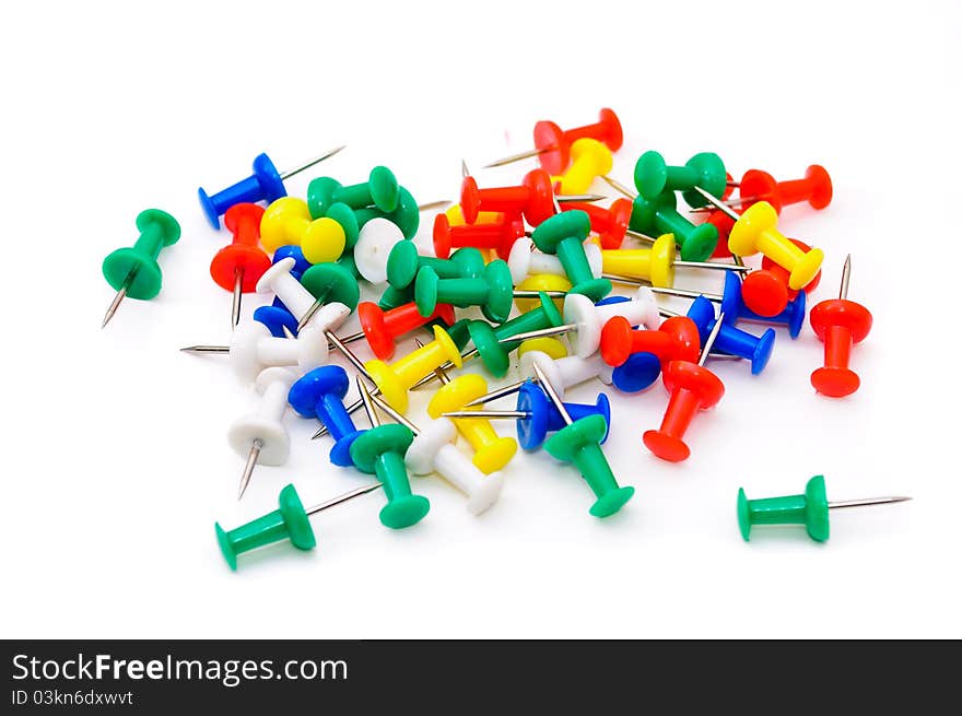 Colored plastic pins. Isolated on white background