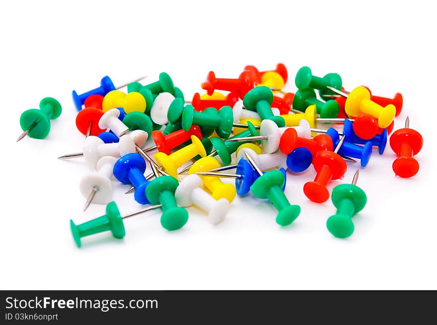 Colored plastic pins. Isolated on white background