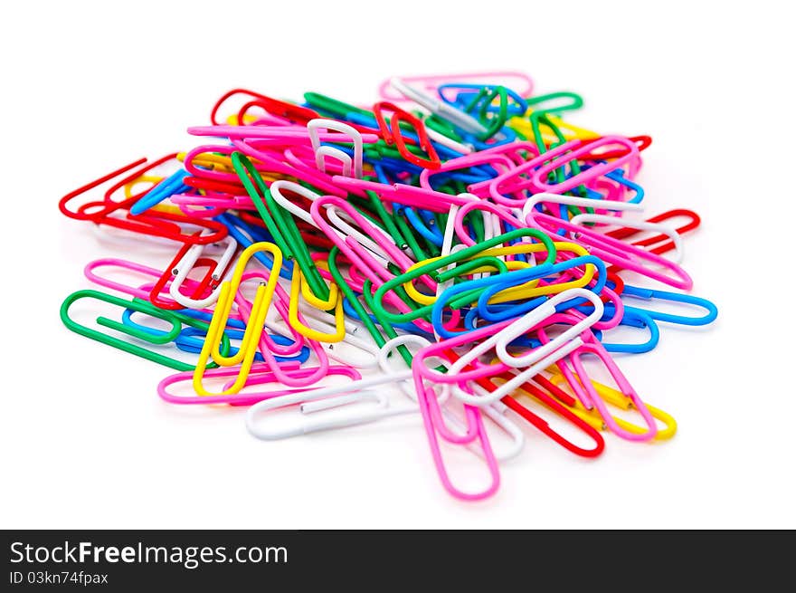 Colored paper clips. Isolated on white background