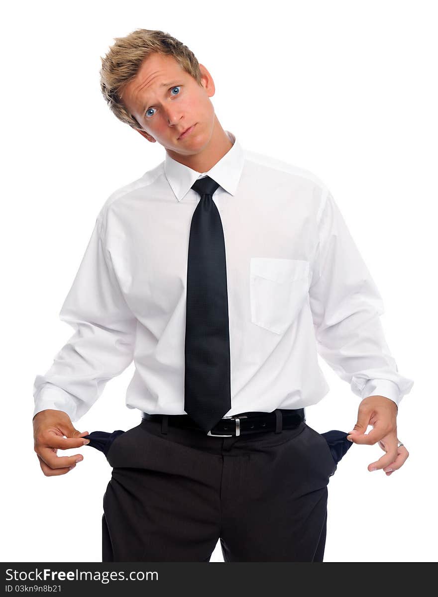 Caucasian man in shirt and tie pulls on his empty pockets. Caucasian man in shirt and tie pulls on his empty pockets