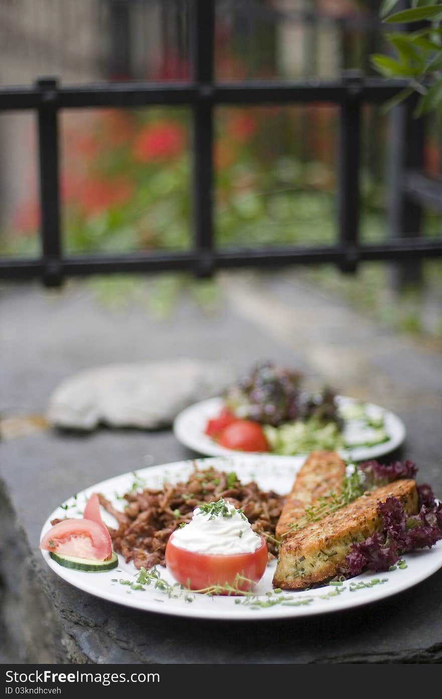 Gyros from lamb served with dumplings and tomatoes. Gyros from lamb served with dumplings and tomatoes