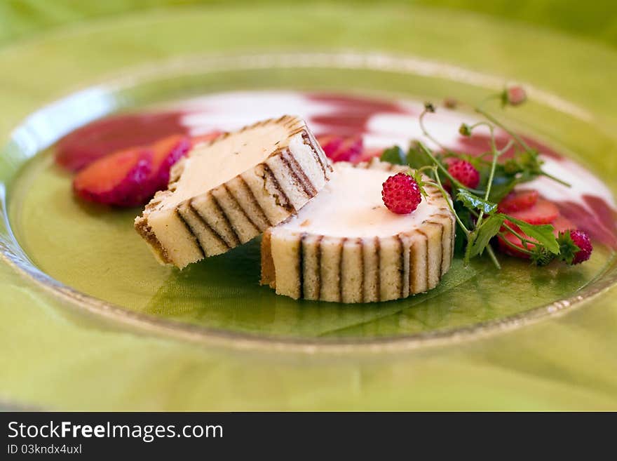 Dessert from biscuit and cream served with strawberries