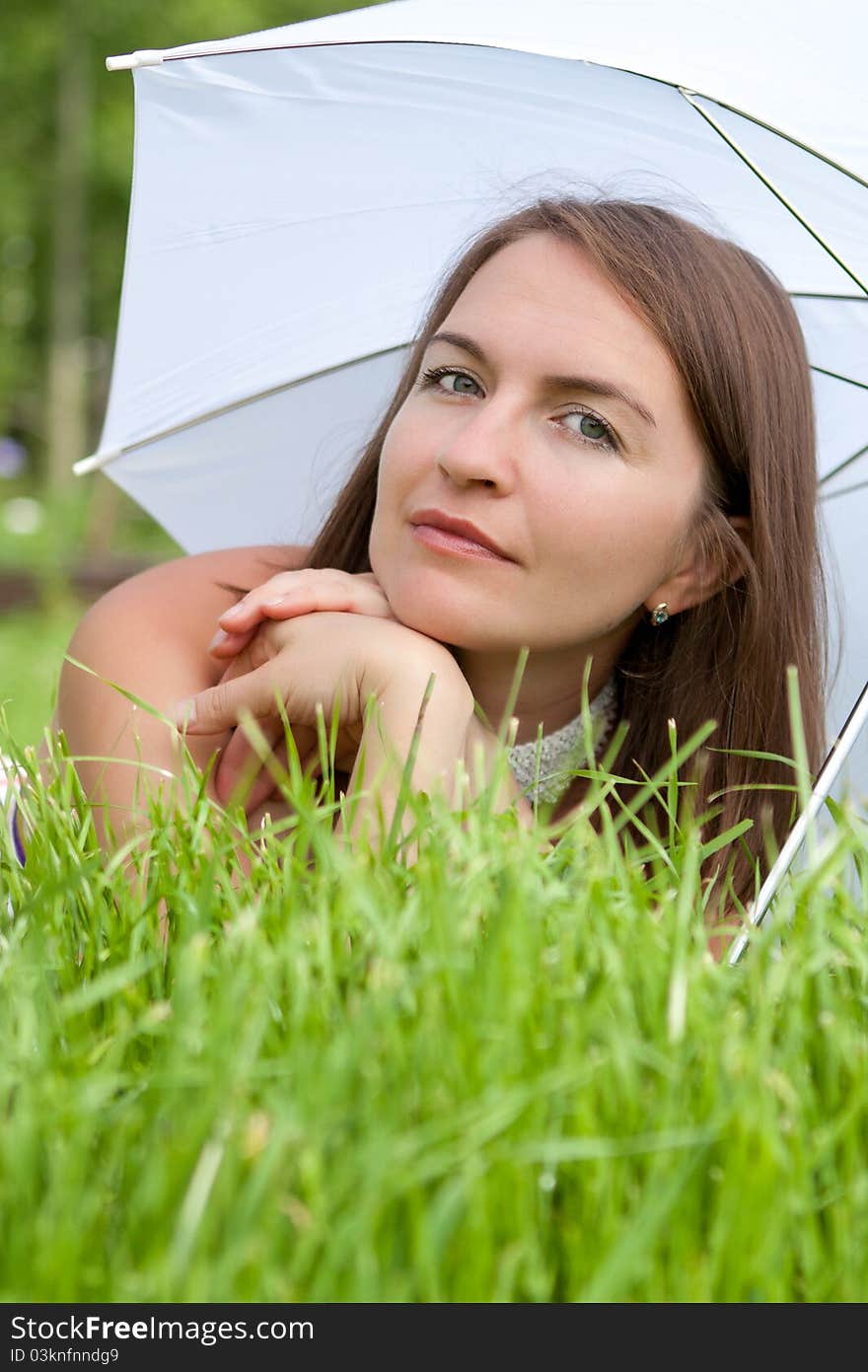 Young Women Lies On Grass