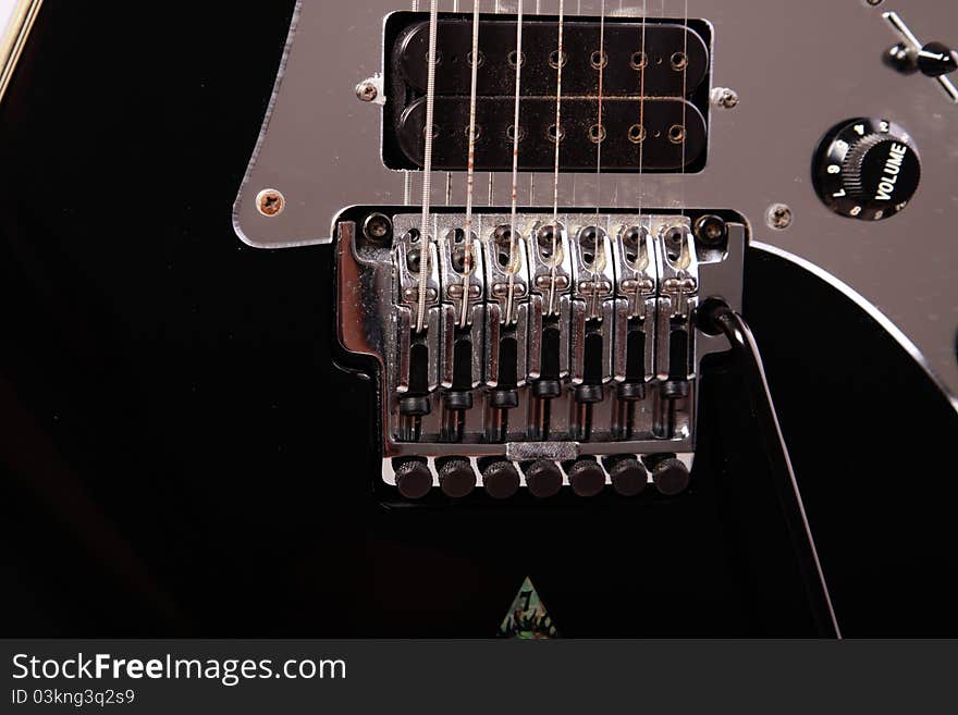 Detail from an electric guitar with tremolo, strings pickup