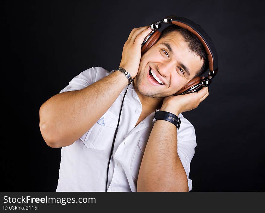 Handsome yound man listening music. Handsome yound man listening music