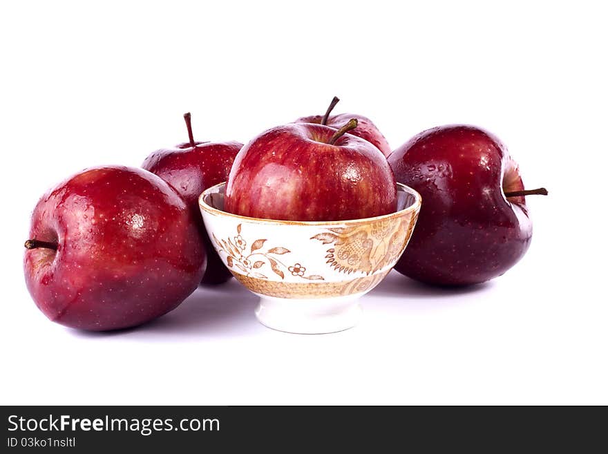 Close up view of some red apples isolated on a white background.