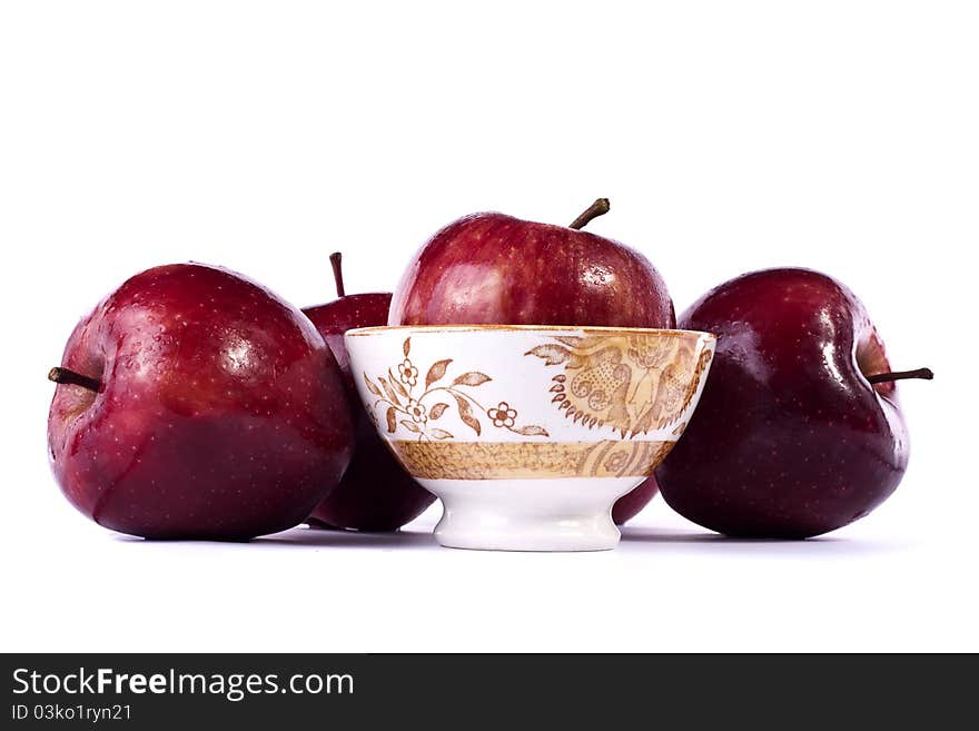 Close up view of some red apples isolated on a white background.