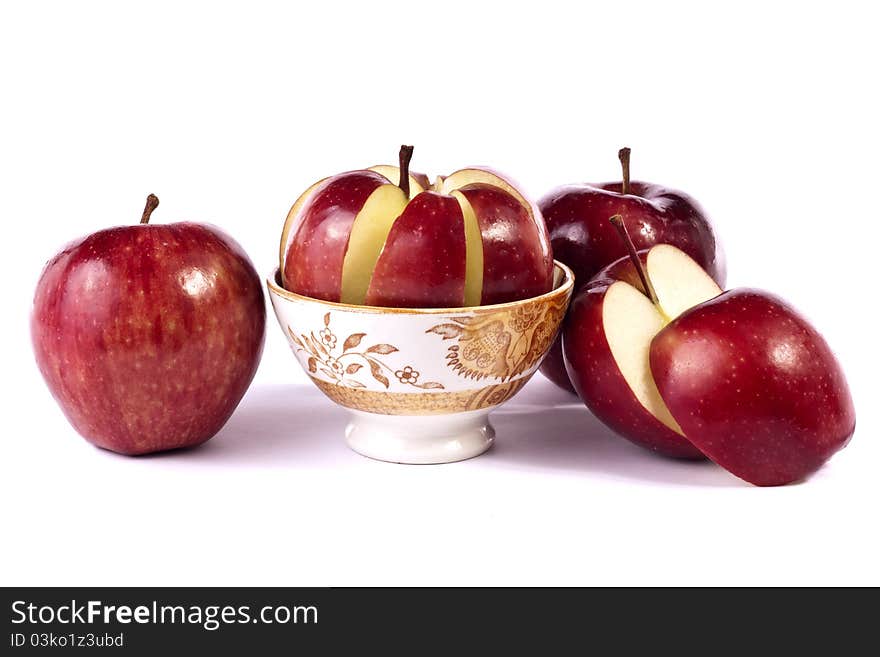 Close up view of some red apples isolated on a white background.