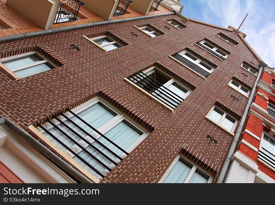 Image of brick building rising up to the sky