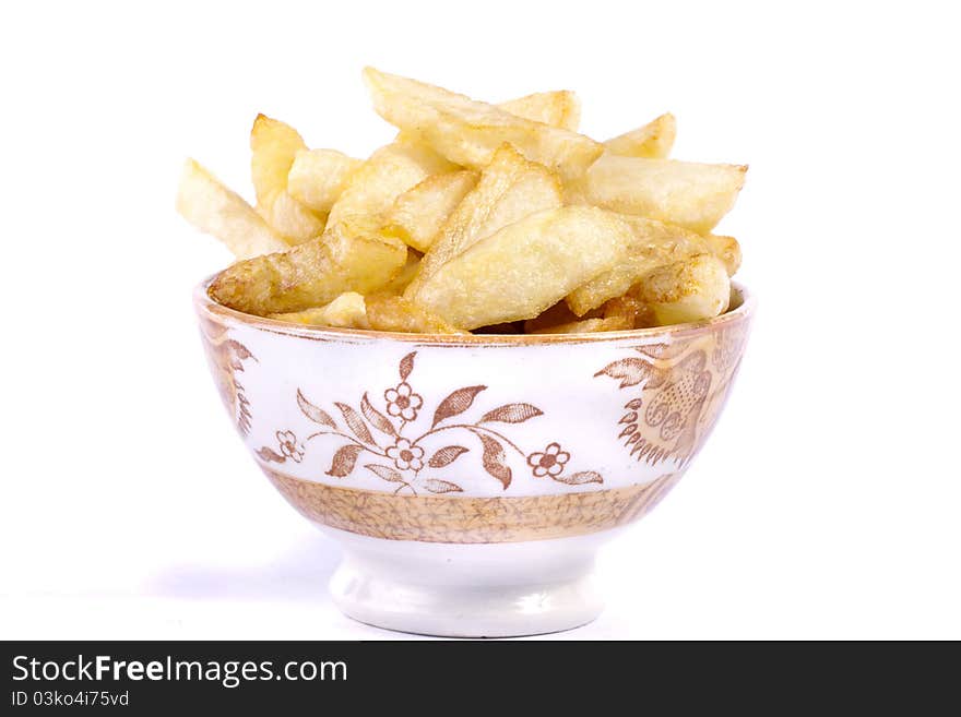 Close up view of a bunch of fried potatoes in slices.