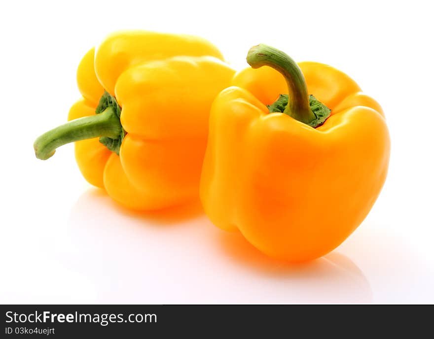 Image of two sweet yellow peppers isolated over white. Image of two sweet yellow peppers isolated over white