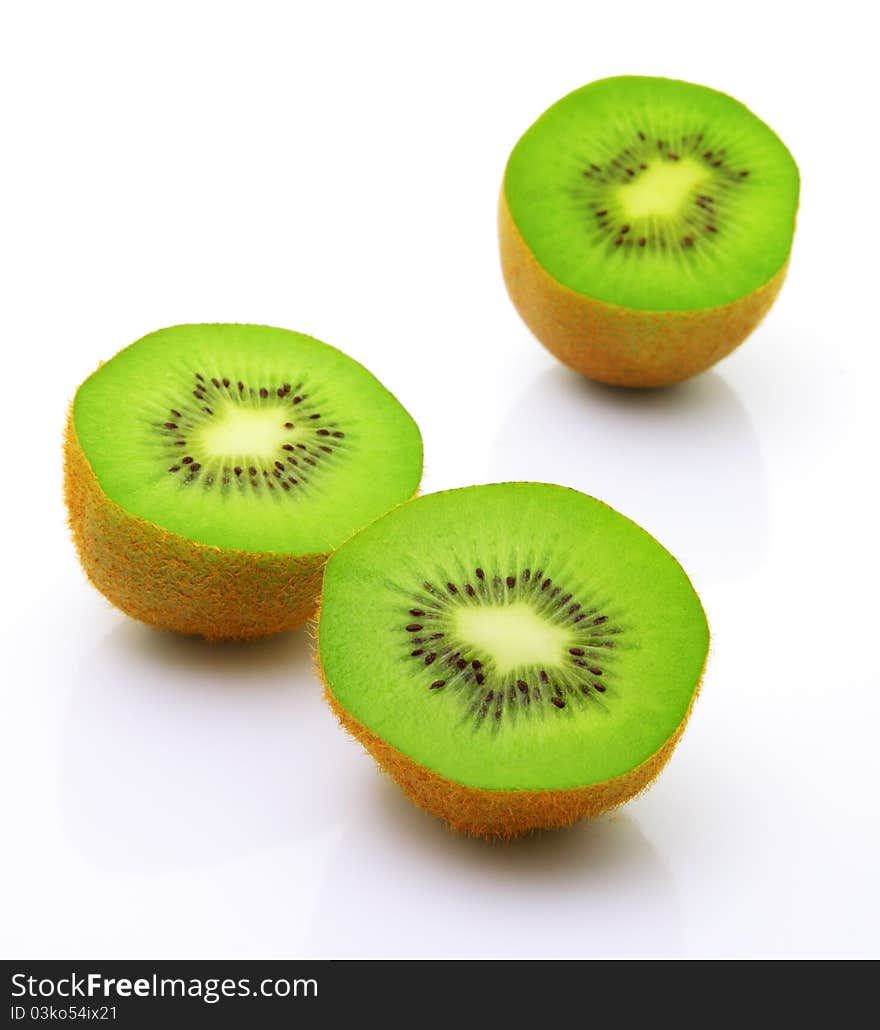 Image of sliced kiwi with reflection isolated over white. Image of sliced kiwi with reflection isolated over white