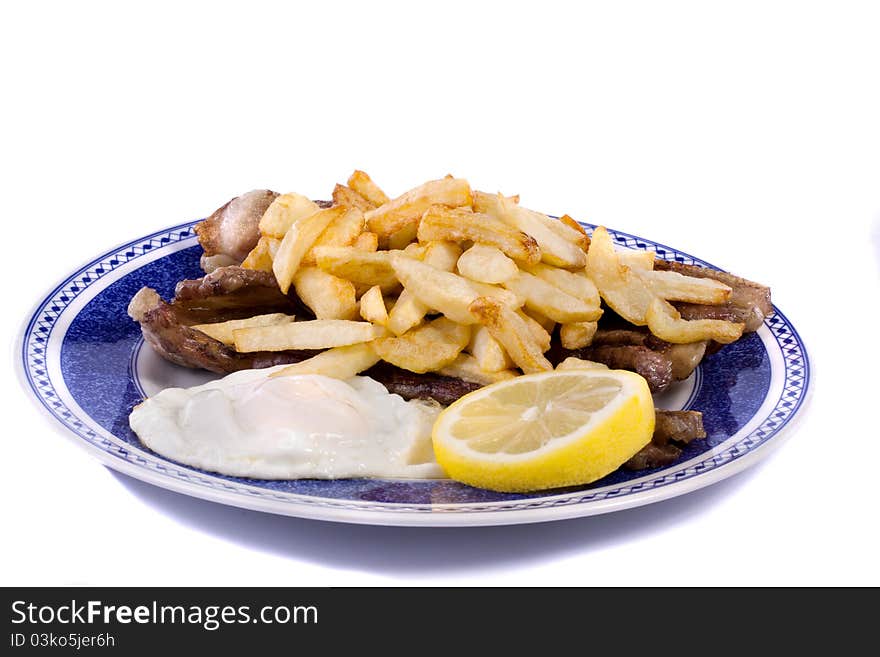 Close up view of a bunch of fried potatoes in slices, with egg and roasted meat. Close up view of a bunch of fried potatoes in slices, with egg and roasted meat.