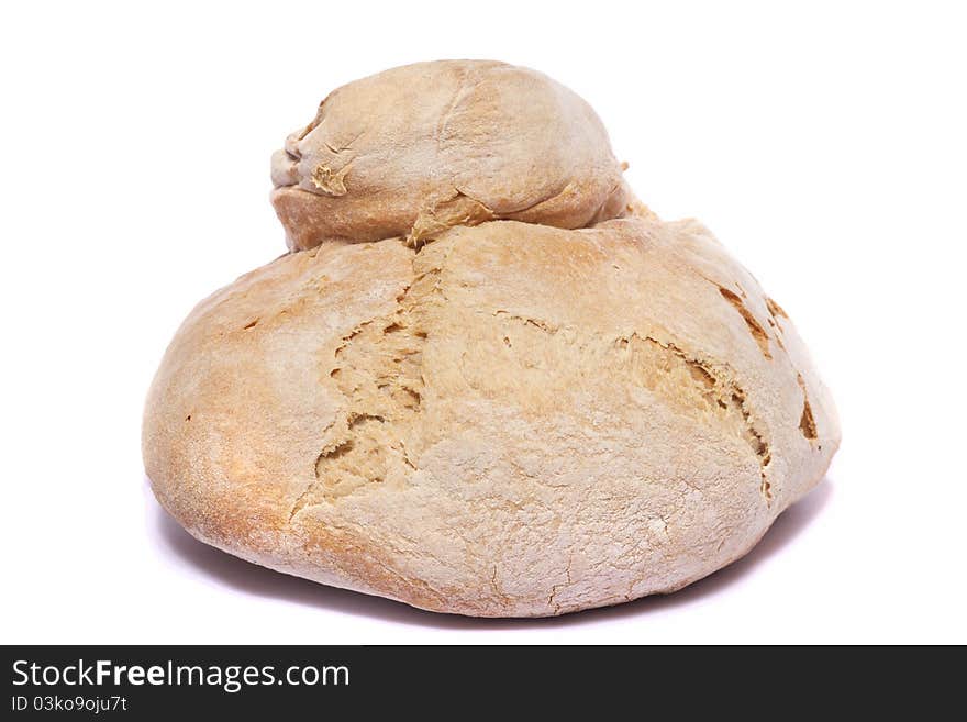 Close up view of a Portuguese traditional baked bread isolated on a white background. Close up view of a Portuguese traditional baked bread isolated on a white background.