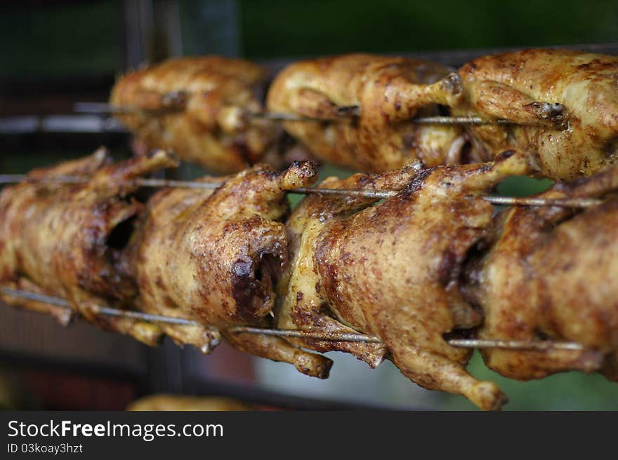 Seven grilled chicken on a spit