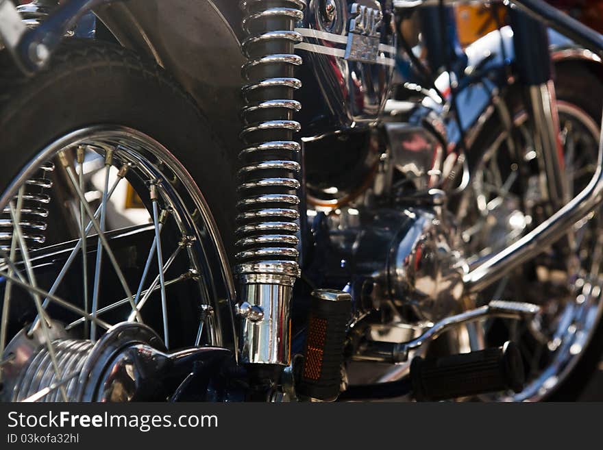 Close up view details of a classic motorcycle in the outdoors.