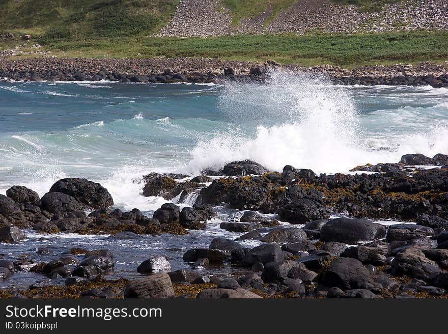 Wave crashing on the shore - giants causeway - Northern Ireland. Wave crashing on the shore - giants causeway - Northern Ireland