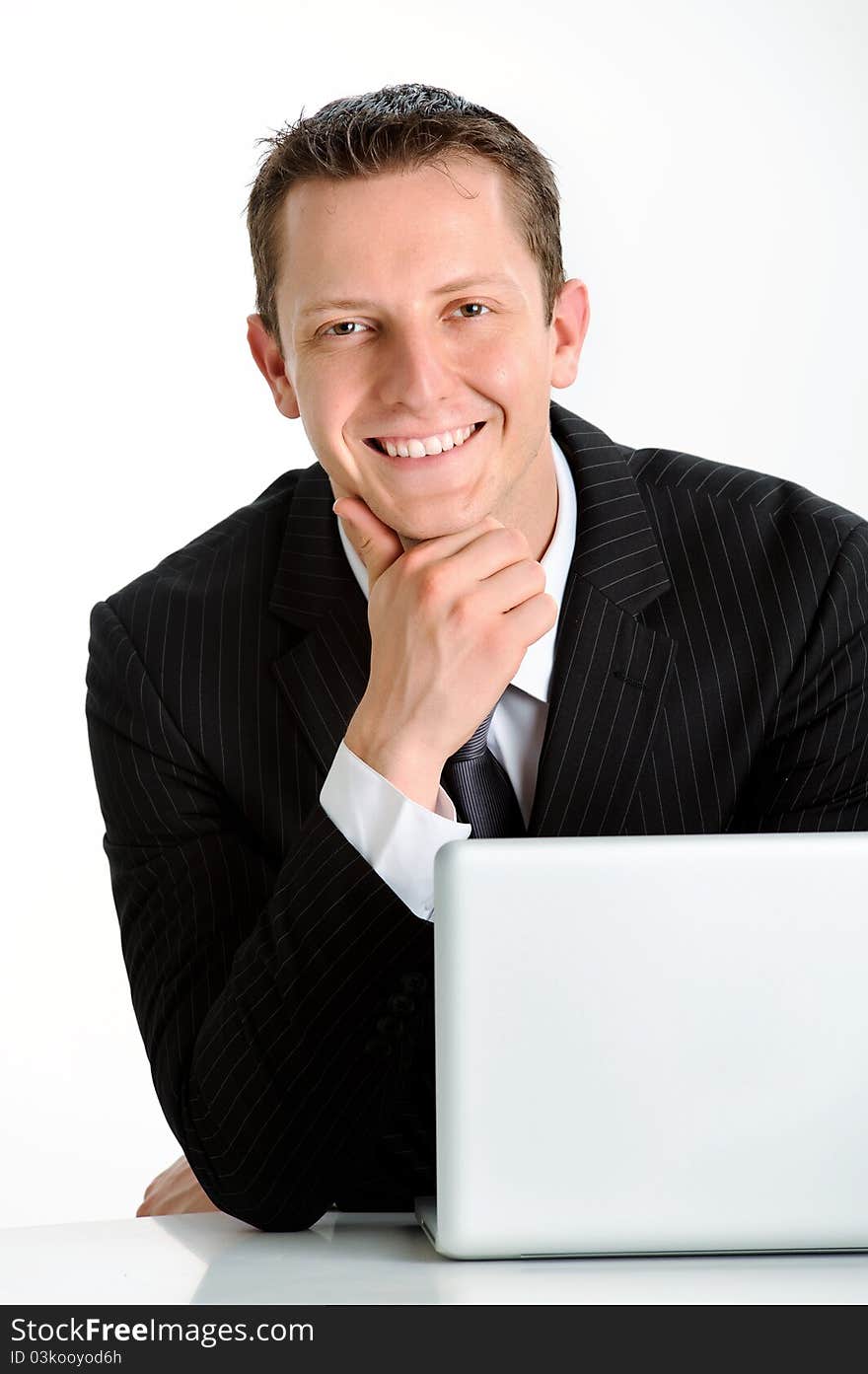 Young caucasian man in business suit smiles for a portrait. Young caucasian man in business suit smiles for a portrait