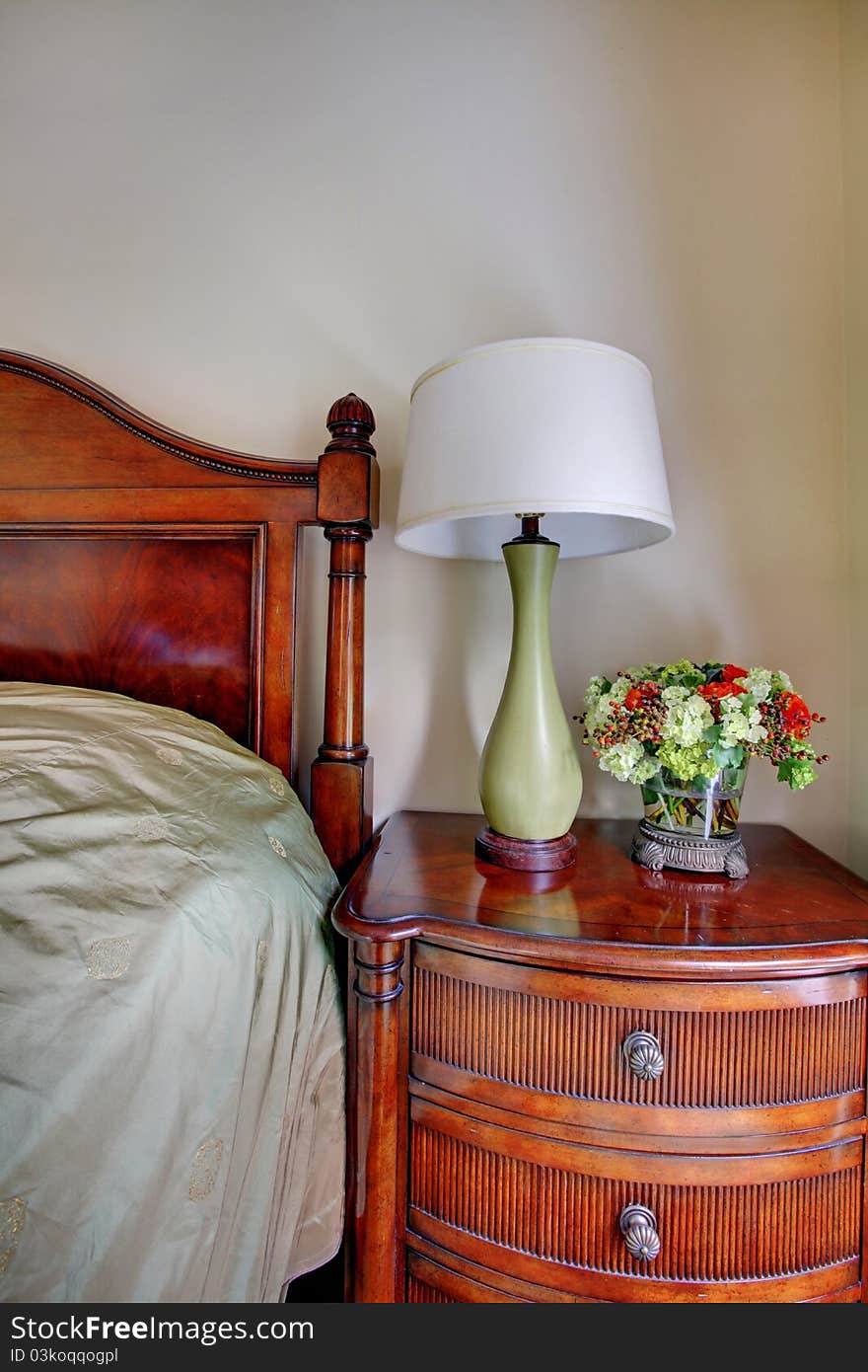 Elegant interior details of the night stand with lamp near bed. Elegant interior details of the night stand with lamp near bed.