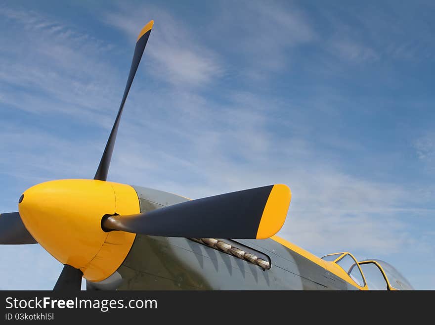 Yellow nose cone and propeller blades of a P-51 Mustang. Yellow nose cone and propeller blades of a P-51 Mustang