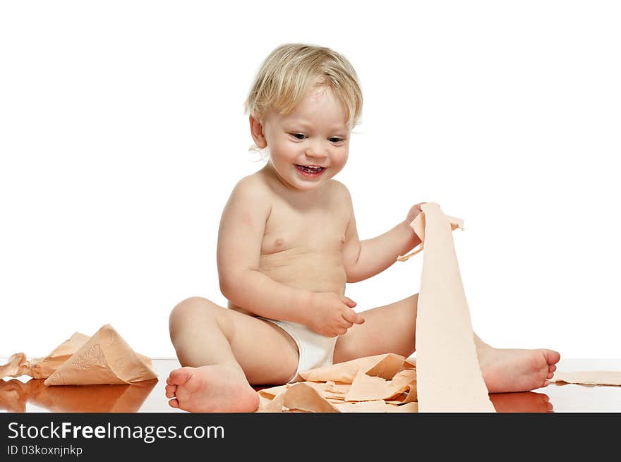 Two years old boy with toilet paper on the table. Two years old boy with toilet paper on the table