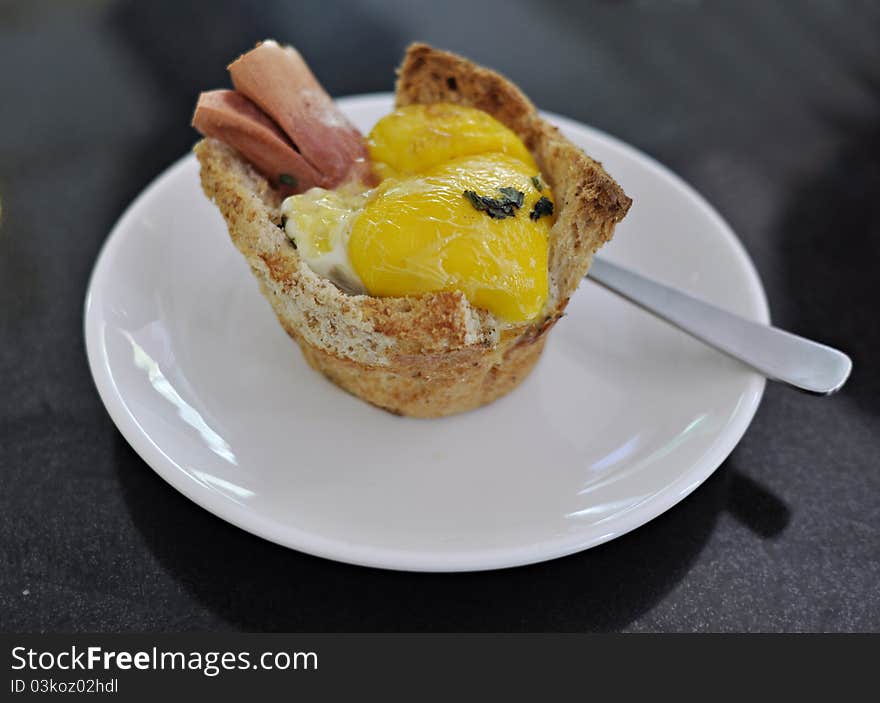 Sausage with egg bun at one newly open cupcakes shop in town. Sausage with egg bun at one newly open cupcakes shop in town