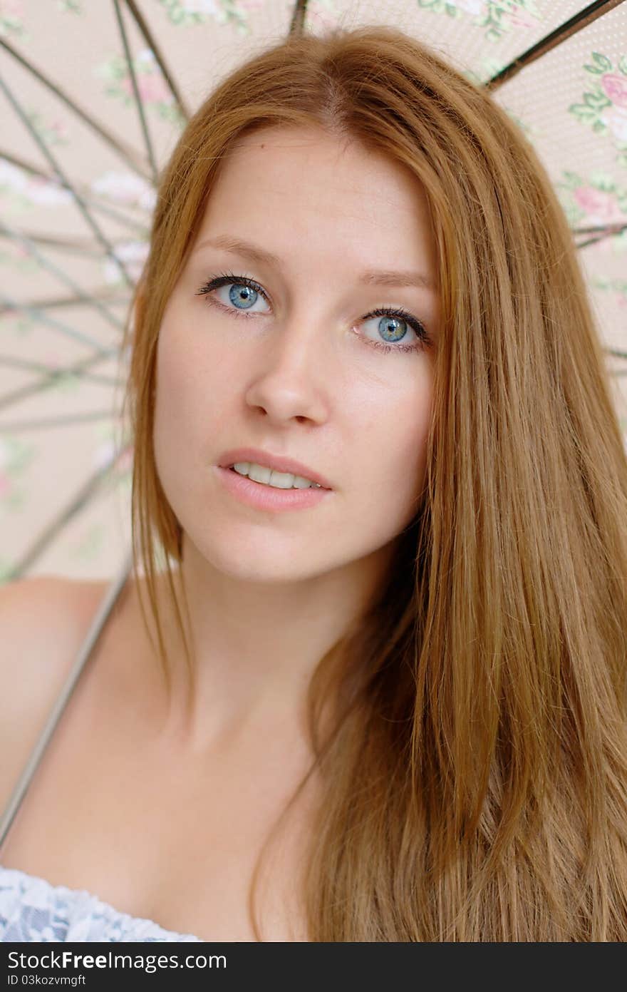 Portrait of a beautiful girl with umbrella at the park. Portrait of a beautiful girl with umbrella at the park