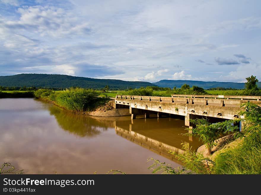 Irrigation canal and bridge in the countryside of Thailand