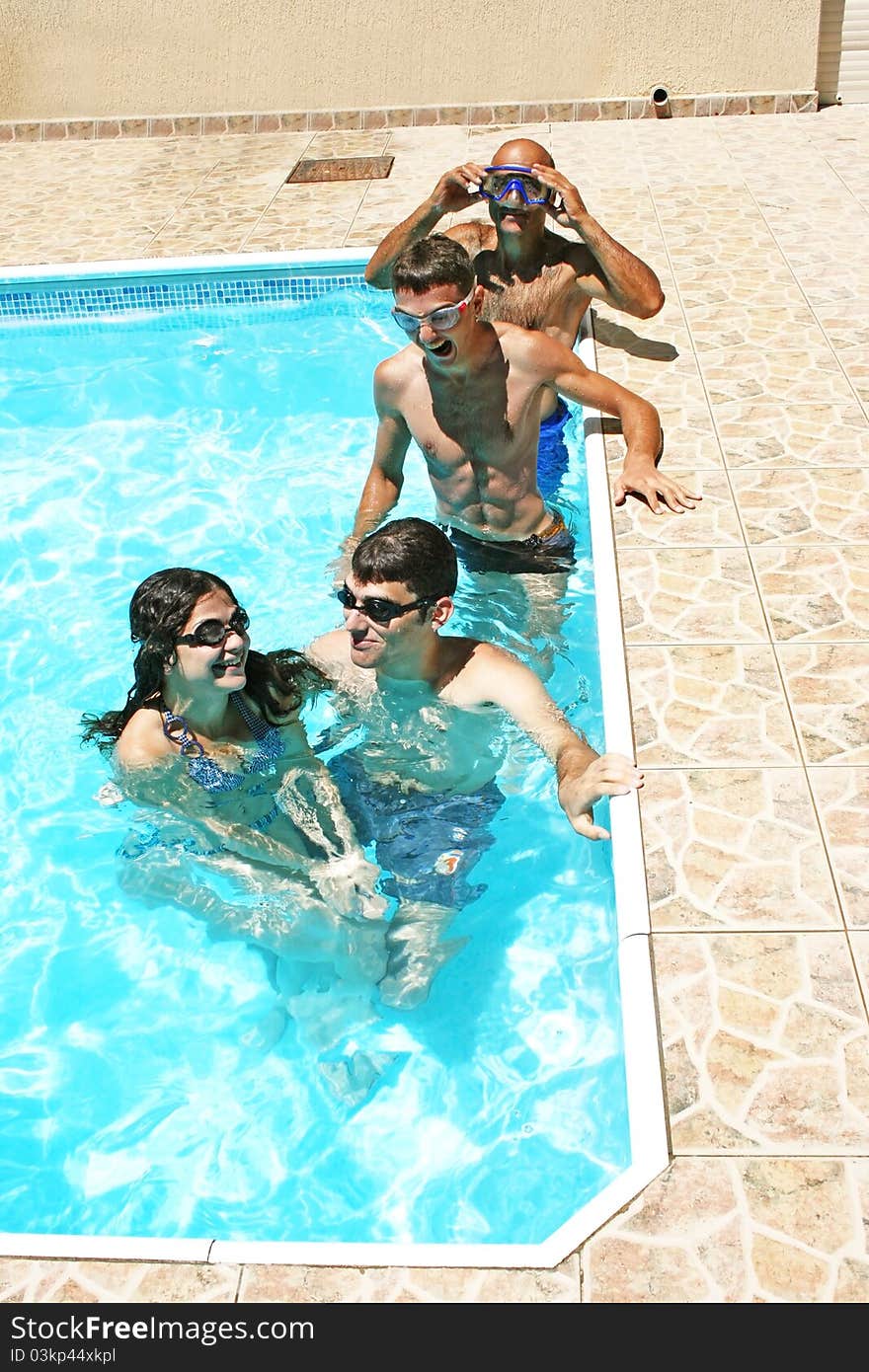 People having fun in  swimming pool. People having fun in  swimming pool.