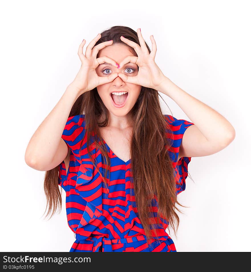 Young beautiful woman making glasses gestures on face on white background. Young beautiful woman making glasses gestures on face on white background