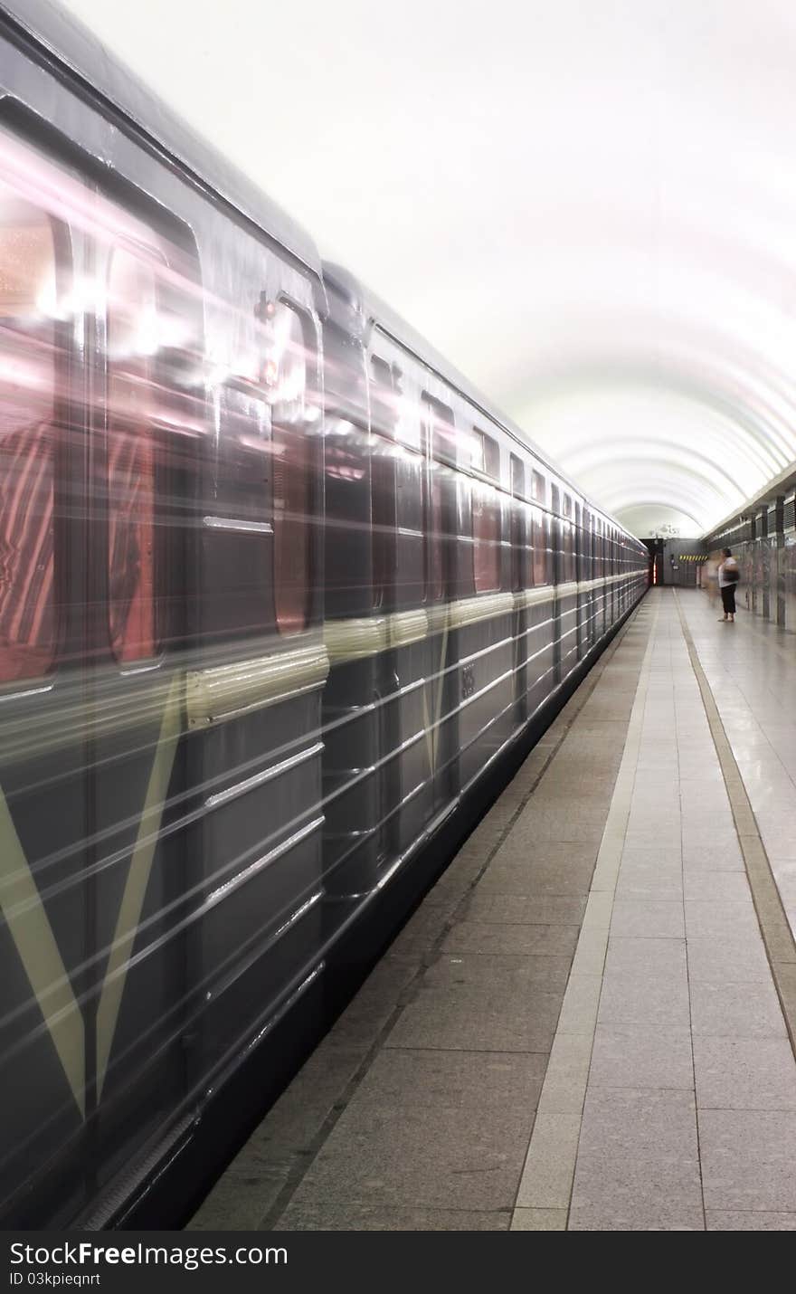 Photo showing the movement Late in the subway. Visible windows of cars; the silhouettes of passengers;. Photo showing the movement Late in the subway. Visible windows of cars; the silhouettes of passengers;