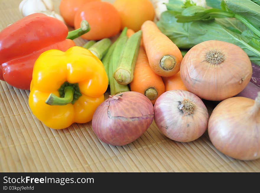 Various types of vegetables placed on bamboo mat. Various types of vegetables placed on bamboo mat.