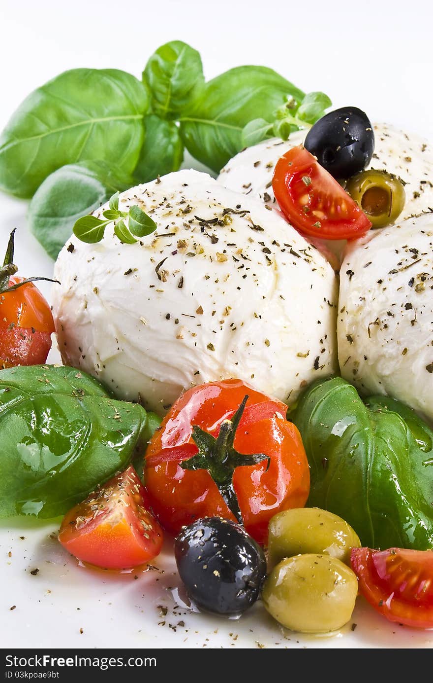 Mozzarella with basil cherry tomatoes and olives