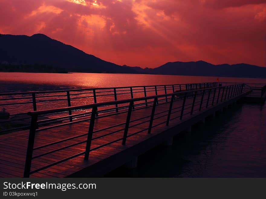 Dock and seascape at dusk