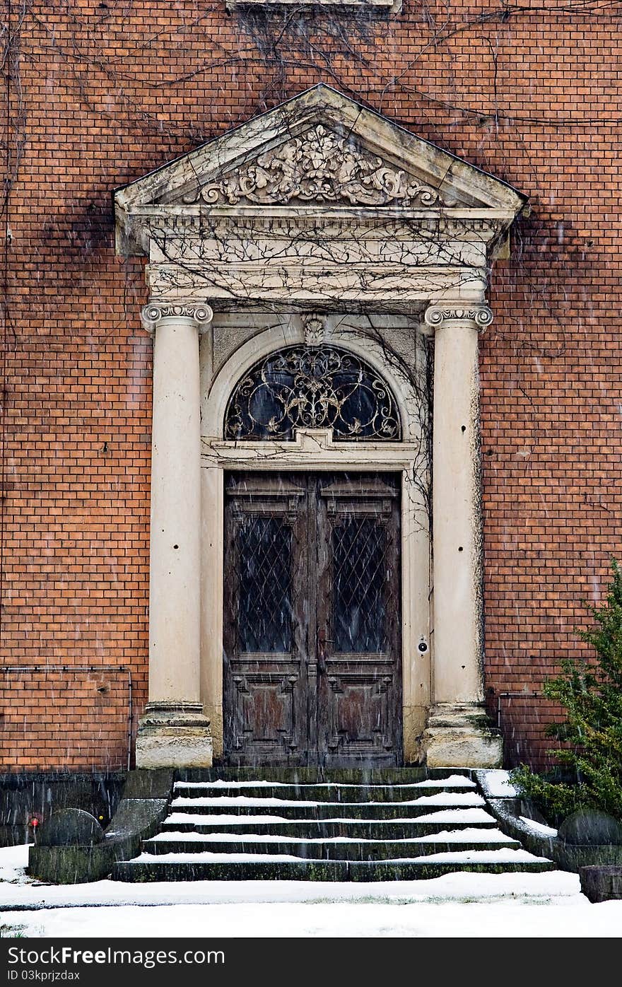 Ancient building with old brick wall in germany. The entrance is well decorated. Ancient building with old brick wall in germany. The entrance is well decorated.