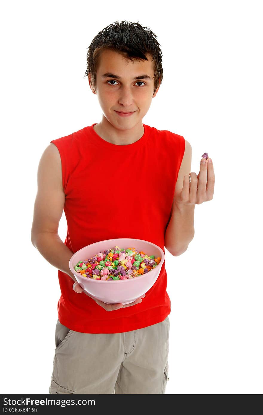 Smiling boy holding a bowl of sugar coated popcorn. White background. Smiling boy holding a bowl of sugar coated popcorn. White background.