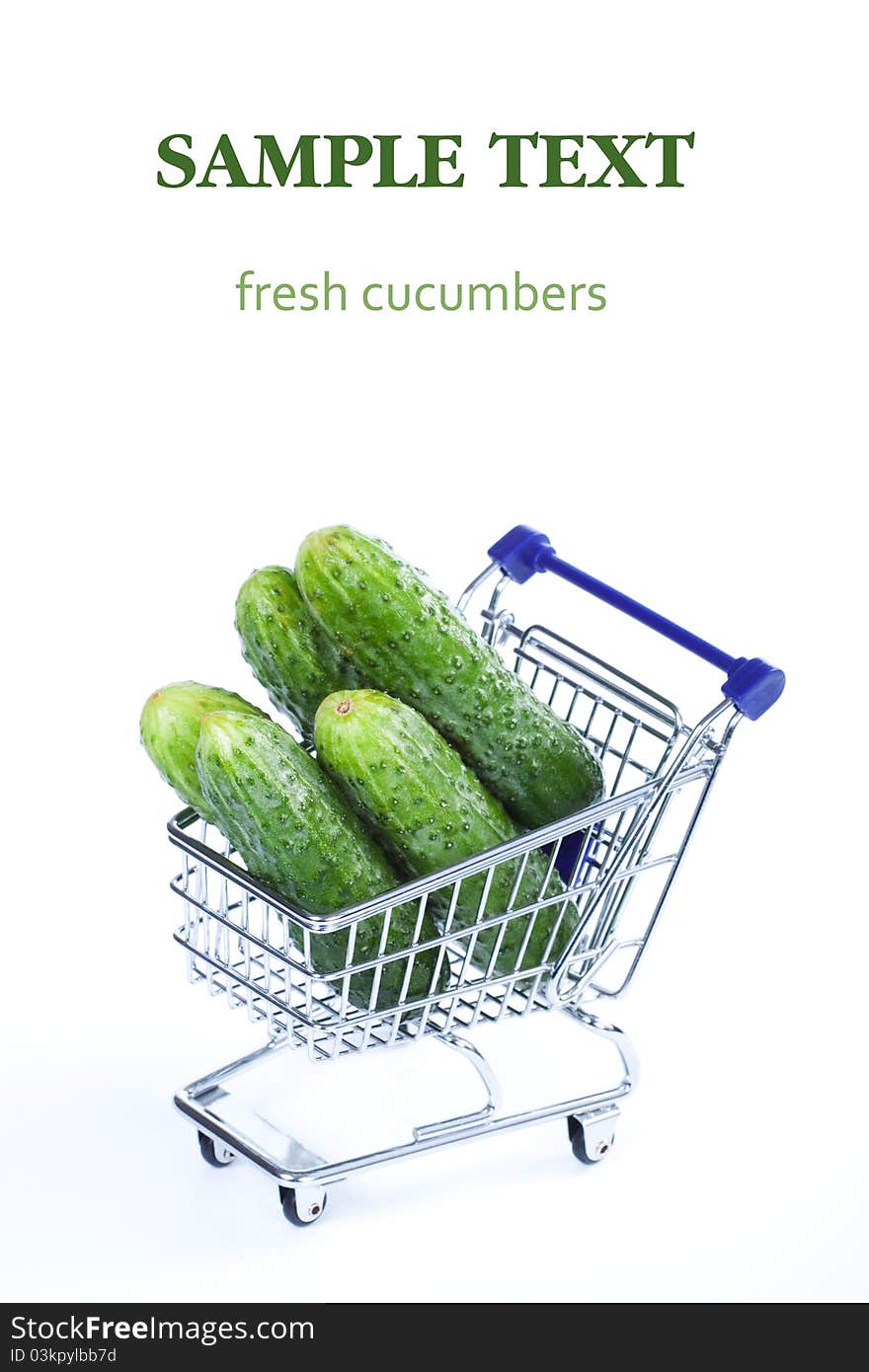 Cucumbers in a shopping cart on a white background