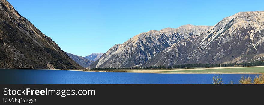 Panorama southern alpine alps mountain range Lake Pearson Arthur's pass National Park New Zealand. Panorama southern alpine alps mountain range Lake Pearson Arthur's pass National Park New Zealand