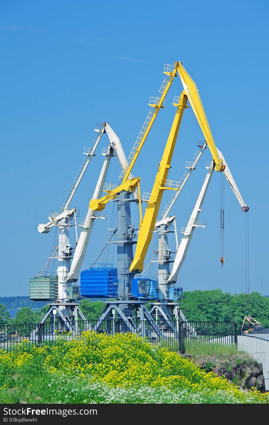 Cranes on a blue sky background