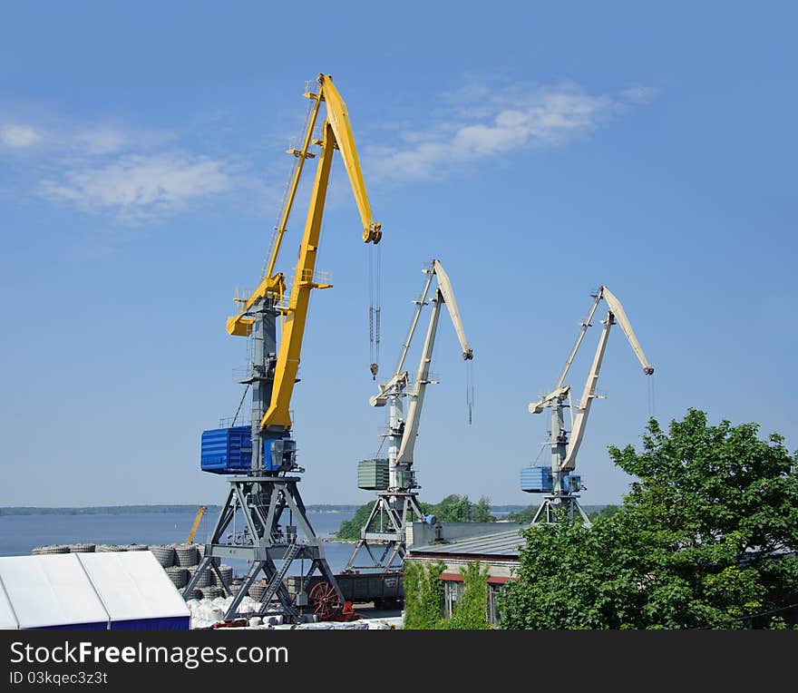 Cranes on a blue sky background