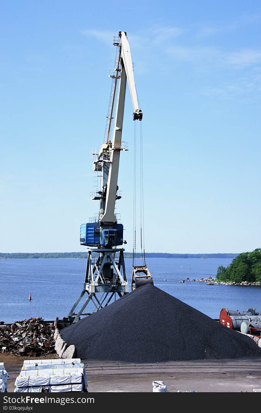 Crane against a background of blue sky. Crane against a background of blue sky