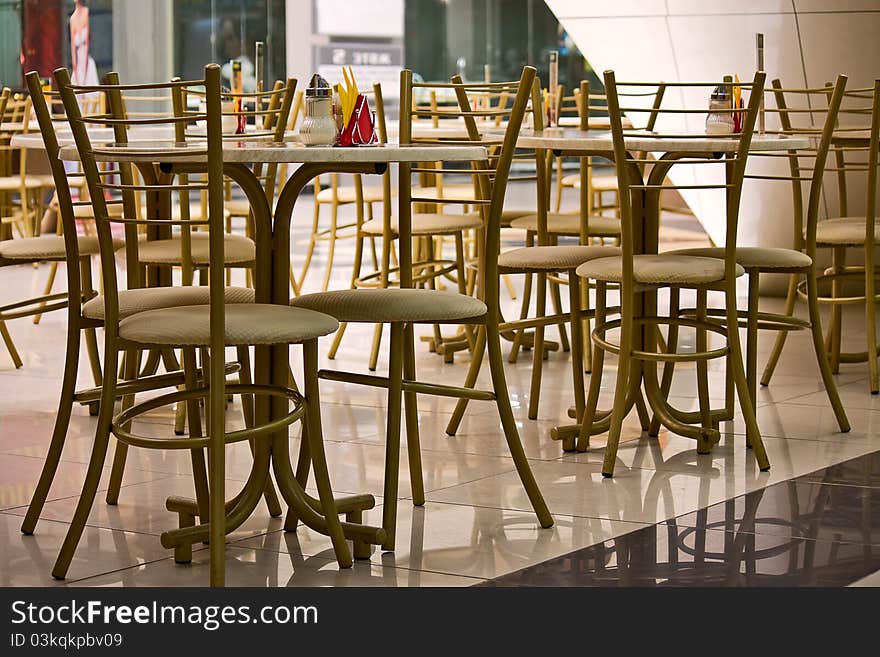 Cafe tables and chairs close to  shopping center. Cafe tables and chairs close to  shopping center.