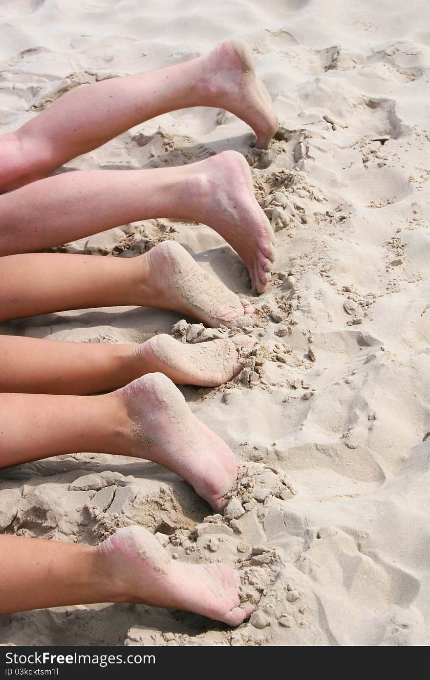 Family lying on a beach and having sunbath