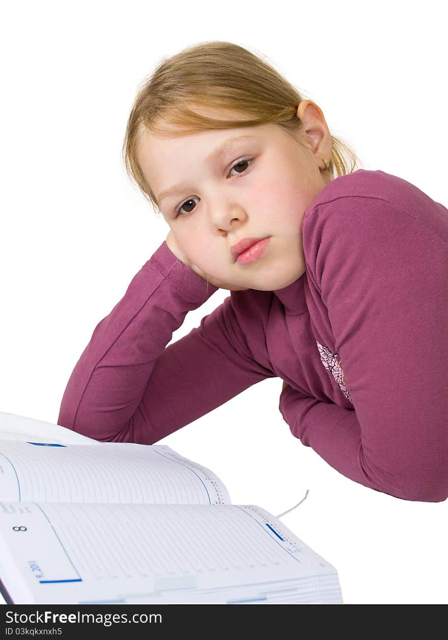 Little girl sleeping while doing her studies isolated