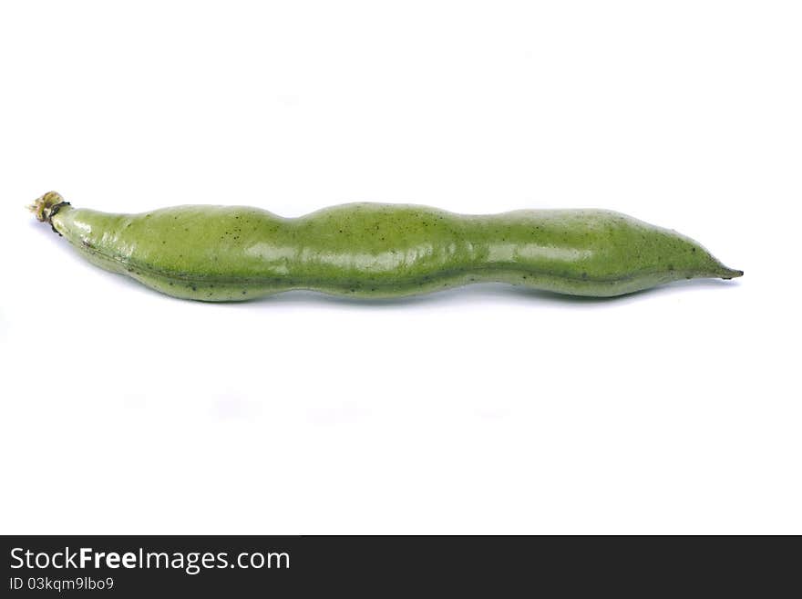 Close up view of some broad beans isolated on a white background.