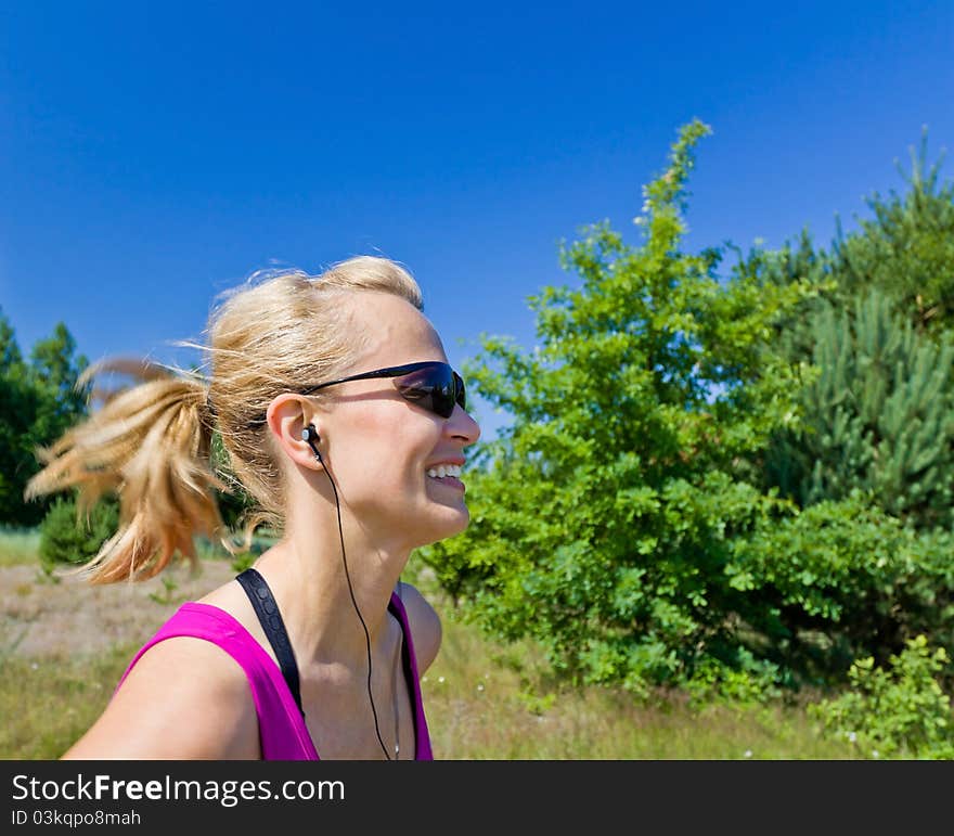 Woman running on country road in summer nature, blurred motion. Woman running on country road in summer nature, blurred motion